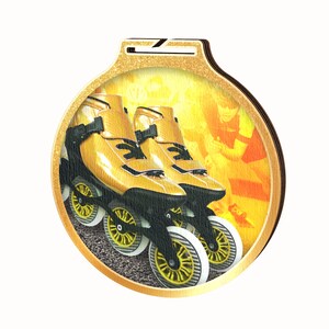 May include: Gold-colored medal with a design of two inline skates with black wheels and yellow accents. The background is a blurred image of a person roller skating.