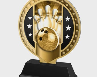 May include: A gold-colored bowling trophy with a black base. The trophy features a bowling ball and pins in the center, surrounded by a gold frame with stars. The design is a classic representation of bowling.