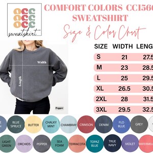 May include: A gray Comfort Colors CC1566 sweatshirt with a size and color chart. The chart lists sizes S to 3XL, with width measurements from 53.3 to 74.9 cm and lengths from 69.9 to 82.6 cm. Color options include Blue Jean, Butter, and Grey.