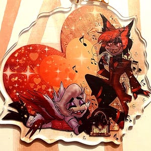 Radioapple Lucifer and Alastor keychains