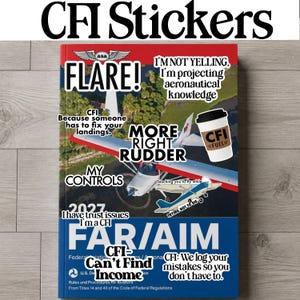 May include: A collection of aviation-themed stickers applied to a 2027 FAR/AIM book. The stickers feature text including FLARE!, I'M NOT YELLING, MORE RIGHT RUDDER, MY CONTROLS, CFI FUEL, and CFI=Can't Find Income, alongside a small airplane graphic.