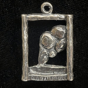 May include: Silver charm with a detailed image of a bear inside a square frame. The charm has the words "Old Faithful" inscribed on the bottom.