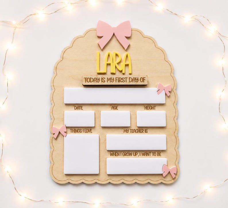 May include: A scalloped wooden sign featuring a pink bow at the top and the name LARA in yellow letters. It includes the text TODAY IS MY FIRST DAY OF, DATE, AGE, HEIGHT, THINGS I LOVE, MY TEACHER IS, and WHEN I GROW UP, I WANT TO BE.