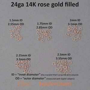 May include: Rose gold filled jump rings in various sizes are displayed against a gray background. The image shows rings with inner diameters (ID) ranging from 1.5mm to 2.5mm, and outer diameters (OD) from 2.55mm to 3.55mm. Text indicates the gauge and material.