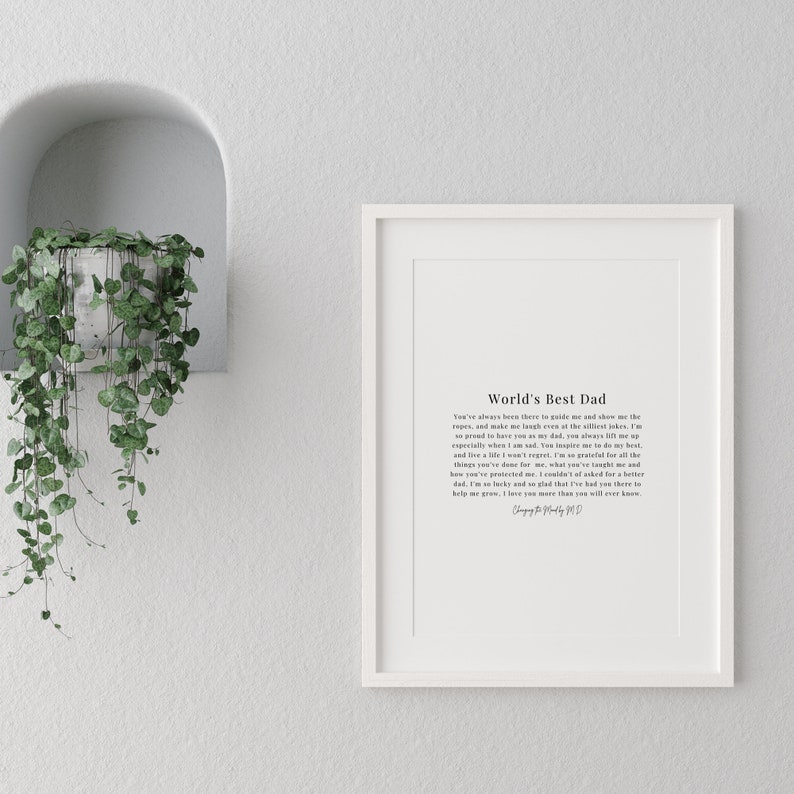 May include: A white framed print featuring a black and white text design that reads "World's Best Dad". The text is a heartfelt message about a father's love and support.