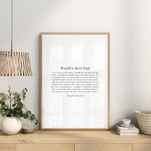 May include: A white printable poster with a black and white text design that reads "World's Best Dad". The text is a poem about a father's love and guidance. The poster is framed in a simple black frame.