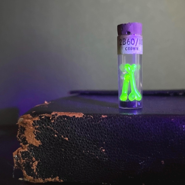 Mini uranium glass bone display | watchmaker vial | uv reactive | curio | collection | handmade | antique |