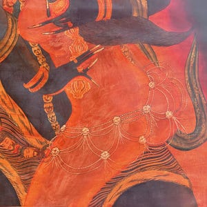 May include: A vibrant painting featuring a central figure with orange skin, adorned with a delicate gold-toned beaded waist chain and dark, claw-like hands. The composition includes intricate patterns, small face motifs, and flowing dark fabric elements.