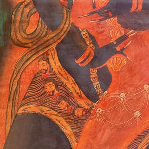 May include: A detailed painting featuring a dark blue figure with long sharp fingernails and a red body. The figure wears a necklace of small skulls and a waist chain with star-shaped ornaments. A snake coils around the figure, and a draped fabric displays a series of small, bearded human heads in a vertical row.