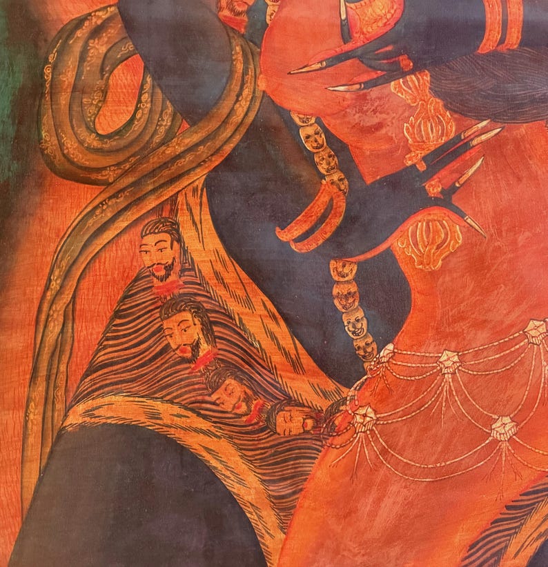 May include: A detailed painting featuring a dark blue figure with long sharp fingernails and a red body. The figure wears a necklace of small skulls and a waist chain with star-shaped ornaments. A snake coils around the figure, and a draped fabric displays a series of small, bearded human heads in a vertical row.
