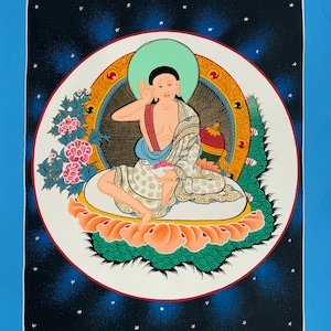 May include: A traditional Tibetan Buddhist thangka painting depicting a deity in a seated position. The deity is surrounded by a mandala with intricate details and vibrant colors. The painting is set against a dark blue background with white stars.