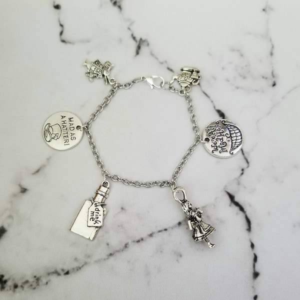 Alice in Wonderland inspired Charm Bracelet stainless steel, 6 charms Alice, Rabbit, teapot, drink me, Mad as a Hatter & We're All Mad Here