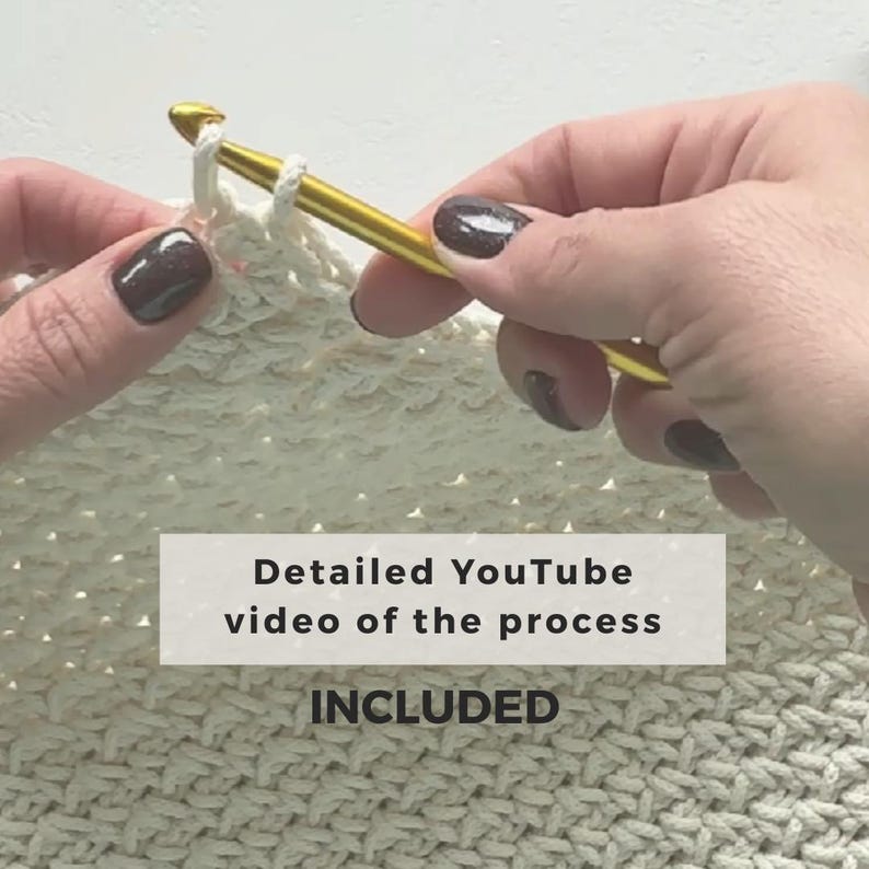 May include: Close-up of hands crocheting with a gold crochet hook and off-white yarn. The image includes the text "Detailed YouTube video of the process INCLUDED". The crochet project is in progress.