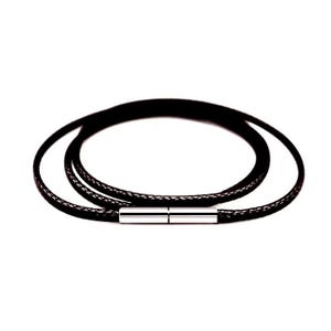 May include: Black leather wrap bracelet with a silver-tone magnetic clasp. The bracelet wraps around the wrist multiple times. The leather appears to be braided. The clasp is a rectangular shape.