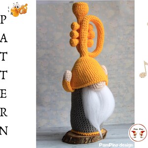May include: A handmade crochet gnome with a trumpet, featuring a yellow hat and instrument, a gray body, and a white beard. The word "PATTERN" is vertically displayed on the left. The design includes musical notes and the "PamPino design" logo.