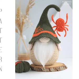 May include: A crochet Halloween gnome with a long white beard, wearing a green hat with orange accents and a spider. A small green pumpkin sits nearby. The word "PATTERN" is vertically displayed on the left.