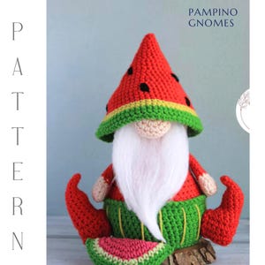 May include: A crochet gnome in a watermelon design. The gnome features a red hat with black seed details, a white beard, and a green and yellow brim. It is wearing a red top and green trousers. The image includes the text "PAMPINO GNOMES".