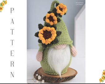 May include: A handmade crochet gnome with a green hat adorned with yellow sunflowers. The gnome has a white beard, pink ears, and is displayed on a wooden slice. The word "PATTERN" is vertically displayed on the left side of the image, and the text "PAMPINO GNOMES" is on the upper right.