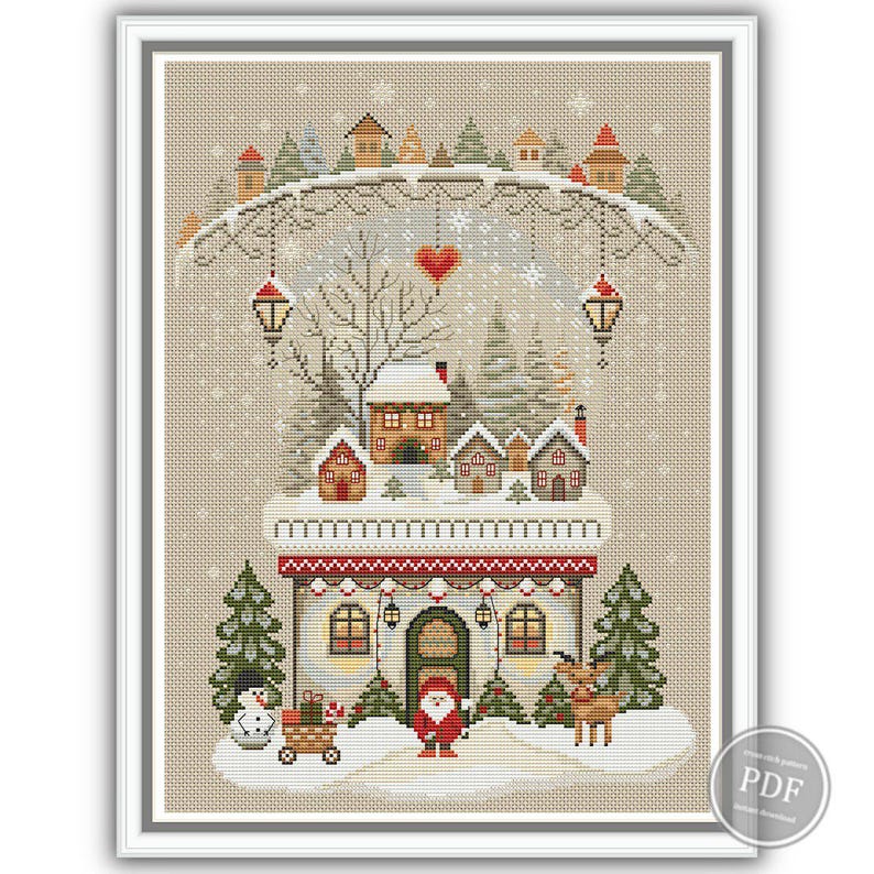 Primitive Christmas cross stitch pattern featuring a cozy winter house with a gnome, snowman, reindeer, and heart garlands. Surrounded by snowy trees and festive lanterns. Ideal for rustic holiday decor or handmade gifts. Instant download PDF for embroidery lovers.