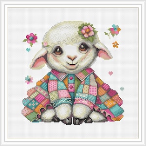May include: A cross-stitch image of a seated lamb wearing a patchwork quilt-style coat and a flower crown. The lamb has large brown eyes and pink ears. Pink, blue, and orange flowers are scattered around the lamb against a white background.
