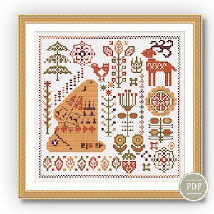 May include: A cross-stitch pattern featuring a stylized deer, bird, and various floral and geometric designs in shades of orange, red, green, and brown. The pattern is framed in a gold frame.
