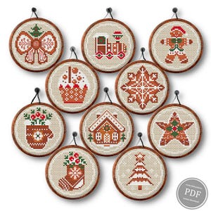 May include: Set of 10 round cross stitch patterns featuring gingerbread themed Christmas ornaments. The ornaments include a gingerbread house, a gingerbread star, a gingerbread man, a gingerbread tree, a gingerbread stocking, a gingerbread snowflake, a gingerbread bow, a gingerbread train, a gingerbread cupcake, and a gingerbread mitten.