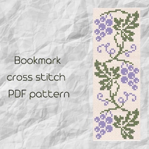 May include: A cross stitch pattern for a bookmark featuring a vine with grapes and leaves in shades of green and purple.