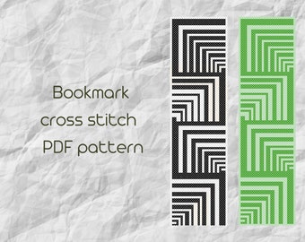 Peut inclure: Motifs de marque-pages en point de croix noir et vert. Les motifs sont géométriques et présentent une série de carrés.