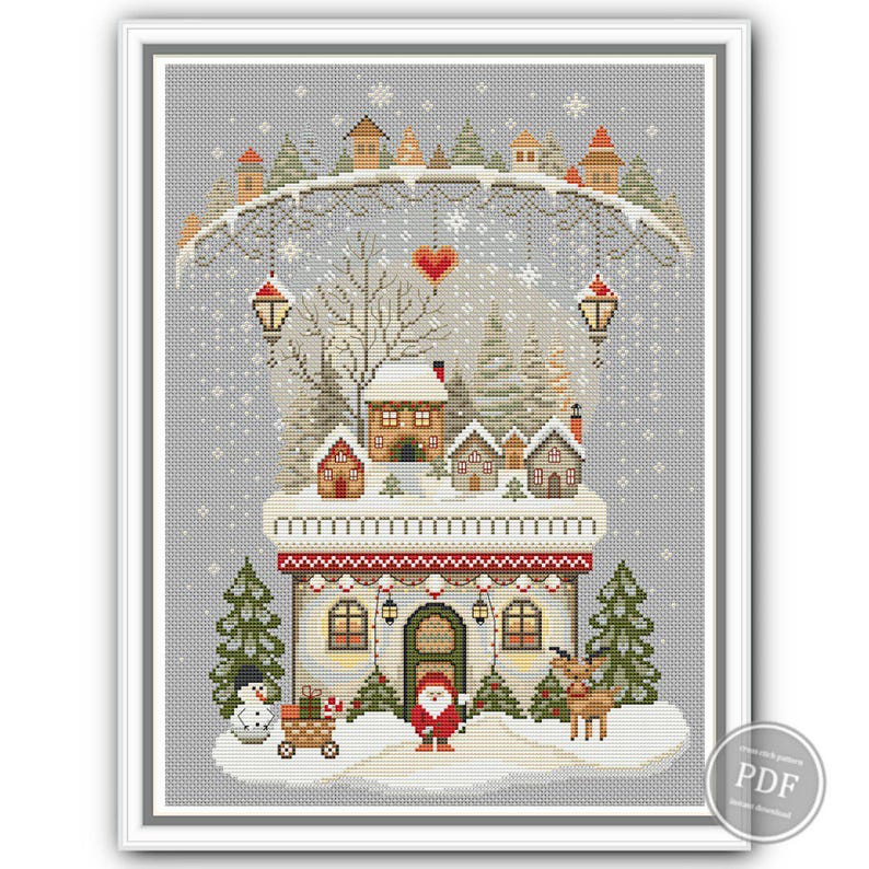 Gray variation of counted cross stitch design showing whimsical winter house, primitive style gnome, red hearts, lanterns, and holiday trees. Perfect for fans of rustic embroidery and cozy Christmas patterns. Digital download PDF.