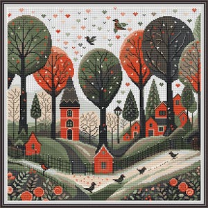 Op de afbeelding: Borduurpatroon met een grillige dorpscene met rode huizen, groene bomen en vogels die in de lucht vliegen. Het patroon is op een witte achtergrond geplaatst met een lichte bestuiving van rode hartjes.