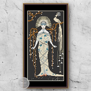 May include: A cross-stitch pattern featuring a woman in a white and blue patterned dress with a bird behind her. The background is black with a floral design.