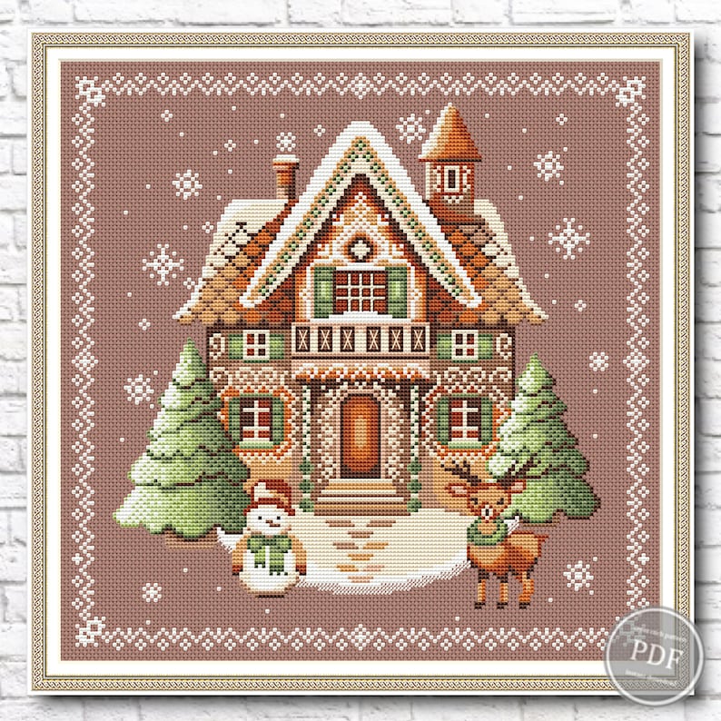 Christmas-themed cross stitch pattern depicting a gingerbread house adorned with white frosting and candy canes, flanked by trees, snowman, and reindeer, set against a blue background with snowflakes.