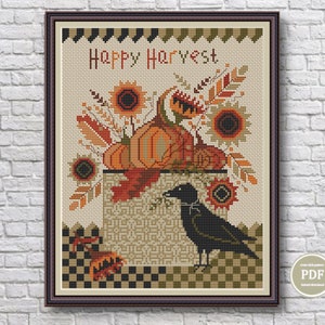 May include: A cross-stitch pattern featuring the text Happy Harvest, a black crow, pumpkins, and sunflowers in shades of orange, yellow, brown, and green. The design includes a checkered border at the bottom and a decorative edge at the top.