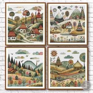 Könnte beinhalten: Vier farbenfrohe Kreuzstichmuster mit fantasievollen Landschaften mit Häusern, Bäumen und Blumen. Jedes Muster ist in einem braunen Holzrahmen gerahmt.