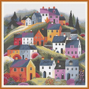 May include: A colourful cross-stitch pattern of a whimsical village with houses in various shapes and sizes. The houses are painted in bright colours, including red, blue, yellow, green, and purple. The village is nestled in a green hillside with trees and flowers.