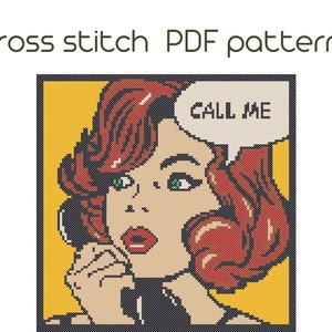 May include: Cross stitch pattern of a woman with red hair and a speech bubble that says "CALL ME". The woman is wearing a black dress and has a phone to her ear. The background is yellow.