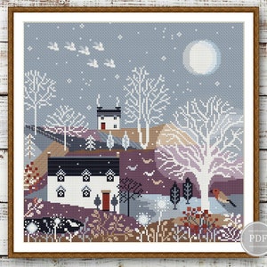May include: Cross stitch pattern featuring a wintery scene with two houses, a full moon, birds flying, and a robin perched on a branch. The houses are white with black trim and red doors. The scene is set against a blue sky with white snow.