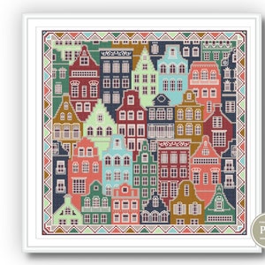 May include: Cross stitch pattern featuring a colorful cityscape with a variety of houses and buildings. The pattern is framed by a decorative border.