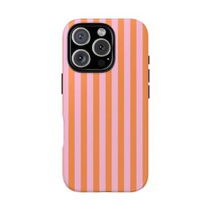 May include: A phone case with a vertical striped pattern in alternating shades of pink and orange. The case has a camera module with three lenses and a flash.