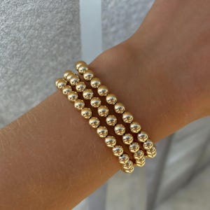 14kt Gold Filled Beaded 6mm bracelet. Gold Filled bead bracelet. Gold bead stretch stacking bracelet. Statement jewellery, chunky bracelet