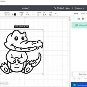 May include: A black and white line drawing of a cartoon alligator with a toothy grin. The alligator is sitting on its hind legs with its front paws folded in front of it. The image is 9.04 cm by 9.26 cm.