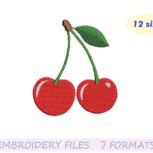 Puede incluir: Diseño bordado de dos cerezas rojas con tallos verdes y una hoja. La imagen incluye el texto "12 tamaños" y "EMBROIDERY FILES 7 FORMATS". Las cerezas están detalladas con reflejos.