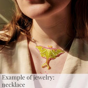 Handmade beaded Luna Moth necklace shown worn, example of finished jewelry from the triangular weave beading pattern