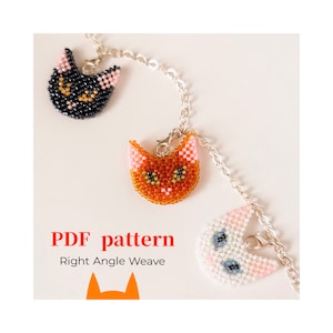 May include: Three beaded cat charms on a silver chain. The cats are black, orange, and white with pink ears and green eyes. The charms are labeled "PDF pattern Right Angle Weave".