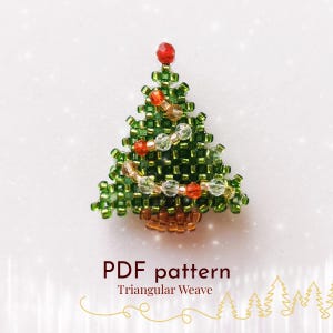 May include: A beaded Christmas tree ornament with a red bead at the top and a brown base. The tree is made of green beads with strands of clear and orange beads. The text "PDF pattern Triangular Weave" is below the tree.