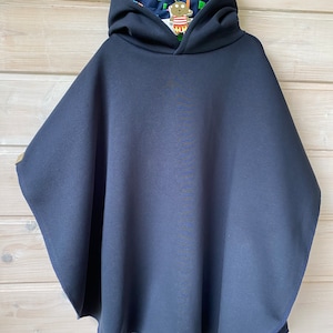 Car seat/stroller poncho with hood. Essential for the safety of your baby and toddler. Cozy winter sweat.