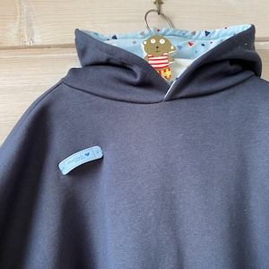 Car seat/stroller poncho with hood. Essential for the safety of your baby and toddler. Cozy winter sweat.