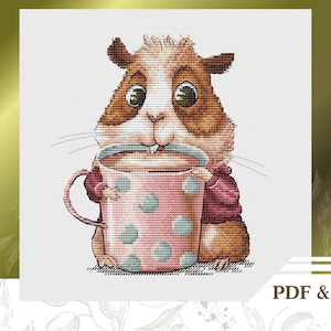 May include: A cross-stitch pattern of a brown and white guinea pig holding a pink and blue polka dot mug. The guinea pig has large brown eyes and a pink nose. The pattern is titled "PDF & Saga".