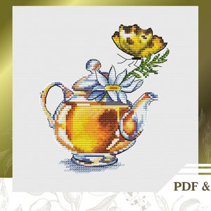 May include: A cross-stitch pattern featuring a teapot with a daisy and a butterfly. The teapot is yellow and orange with a blue handle and spout. The daisy is white with a yellow center. The butterfly is yellow with black markings. The pattern is on a white background.