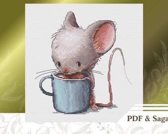 May include: A cross-stitch pattern of a cute gray mouse drinking from a blue mug. The mouse has a pink nose and ears. The pattern includes the text "PDF & Saga".